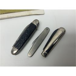 Seven pen knives, two lighters, including one Ronson example and a collection of postcards