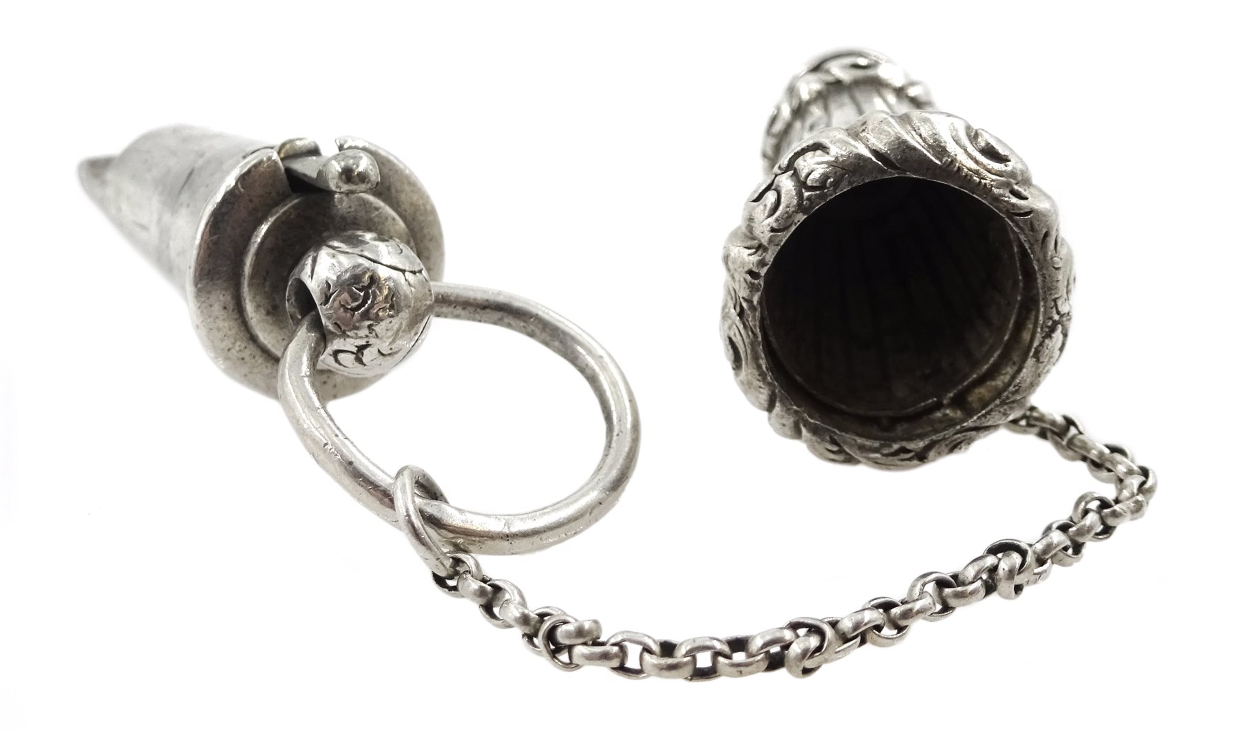 Edwardian silver whistle by William Hornby, London 1902, the metal interior stamped Huloons patent and a Victorian silver whistle, in a silver reeded case by Joseph Jennens & Co, Birmingham 1863