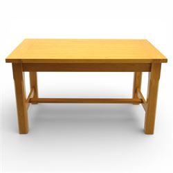 Solid oak dining table and set of seven pine farmhouse chairs including two carvers, rectangular top with tongue and groove style finish, supported a 'H' stretcher with square chamfered legs, pine farmhouse chairs with central splat and turned legs