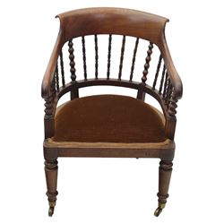 Late 19th-century captain's chair,  with spindle and bobbin turned shaped back, with brown velvet upholstered seat, raised on turned legs with brass castors, old damage and repairs 