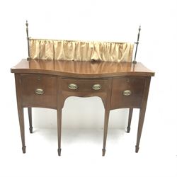 Edwardian mahogany sideboard, raised back rail with turned finals above serpentine top with box wood and chevron stringing, centre drawer and two cupboards, square tapering supports with spade feet, W133cm, H132cm (including rail), D55cm
