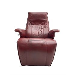 Swivel and adjustable armchair upholstered in red leather