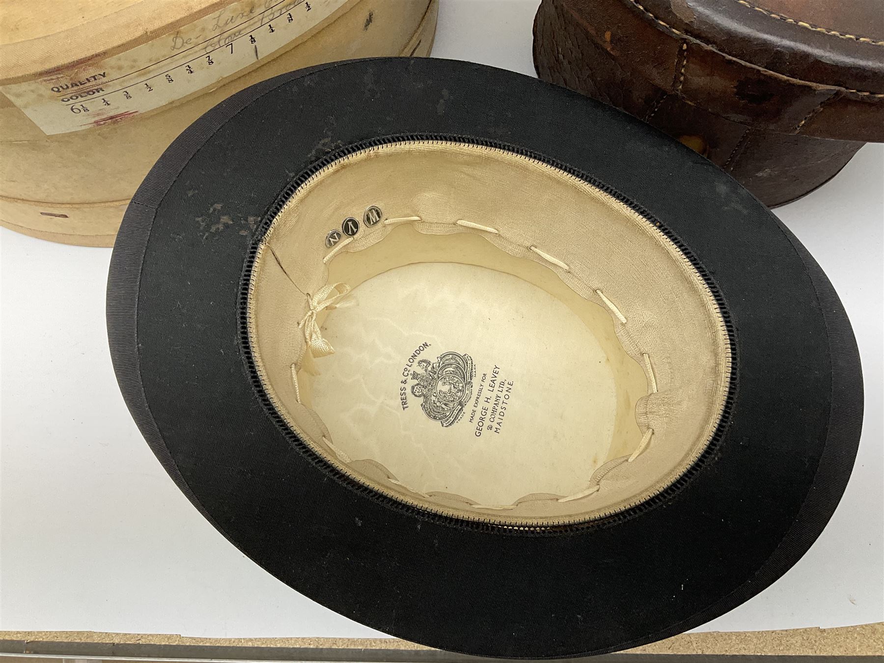 Top hat by Tress & Co London, in a  fitted leather leather case,  Top hat by Chapellerie Francaise. 