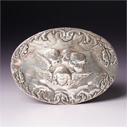 Edwardian silver oval dressing table box, the hinged cover embossed with angel heads W10cm London 1902 Maker William Comyns & Sons and an Edwardisn pierced silver oval sweetmeat basket L18cm Sheffield 1907 Maker James Dixon & Sons Ltd