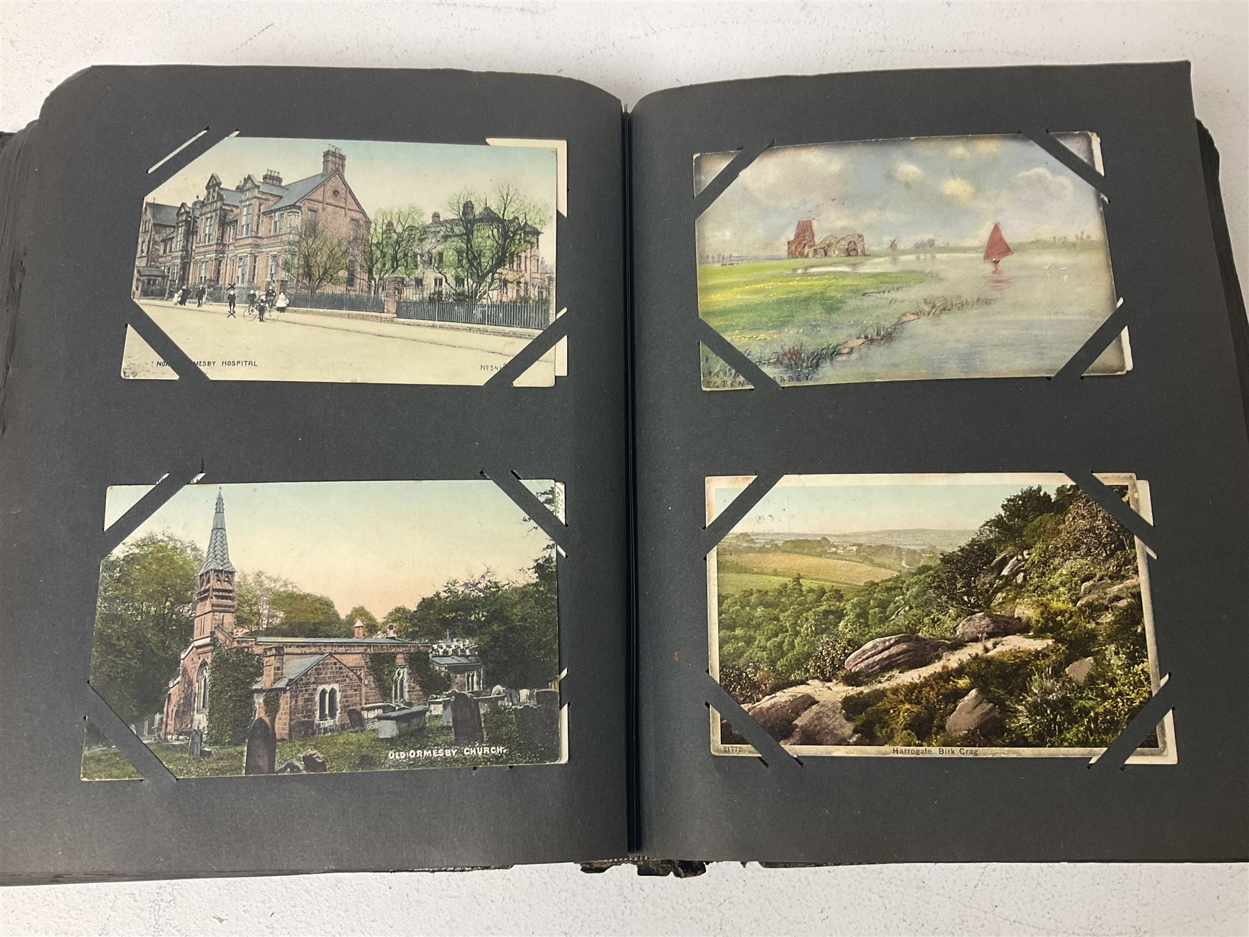 Postcard album with Victorian and later postcards, including silk cards, landscapes of the UK, portraits, Christmas cards etc  