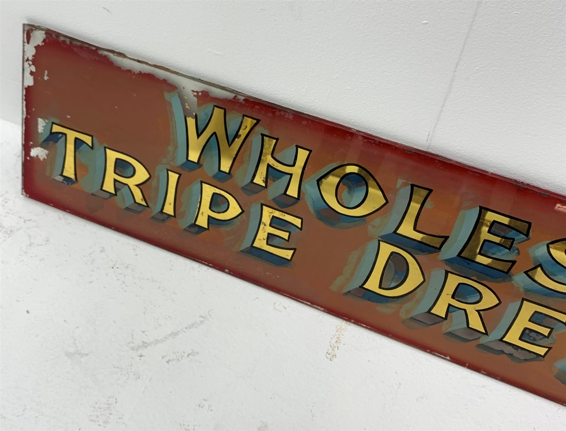  A Vintage reverse painting on glass advertising sign, detailed 'Wholesale Tripe Dressers', 119cm x 26cm