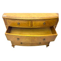 Frank Hudson - mid-20th century Mindi ash and burr walnut 'Spire' bow-fronted chest, featuring a crossbanded top over two short and three long cockbeaded drawers, raised on turned supports  