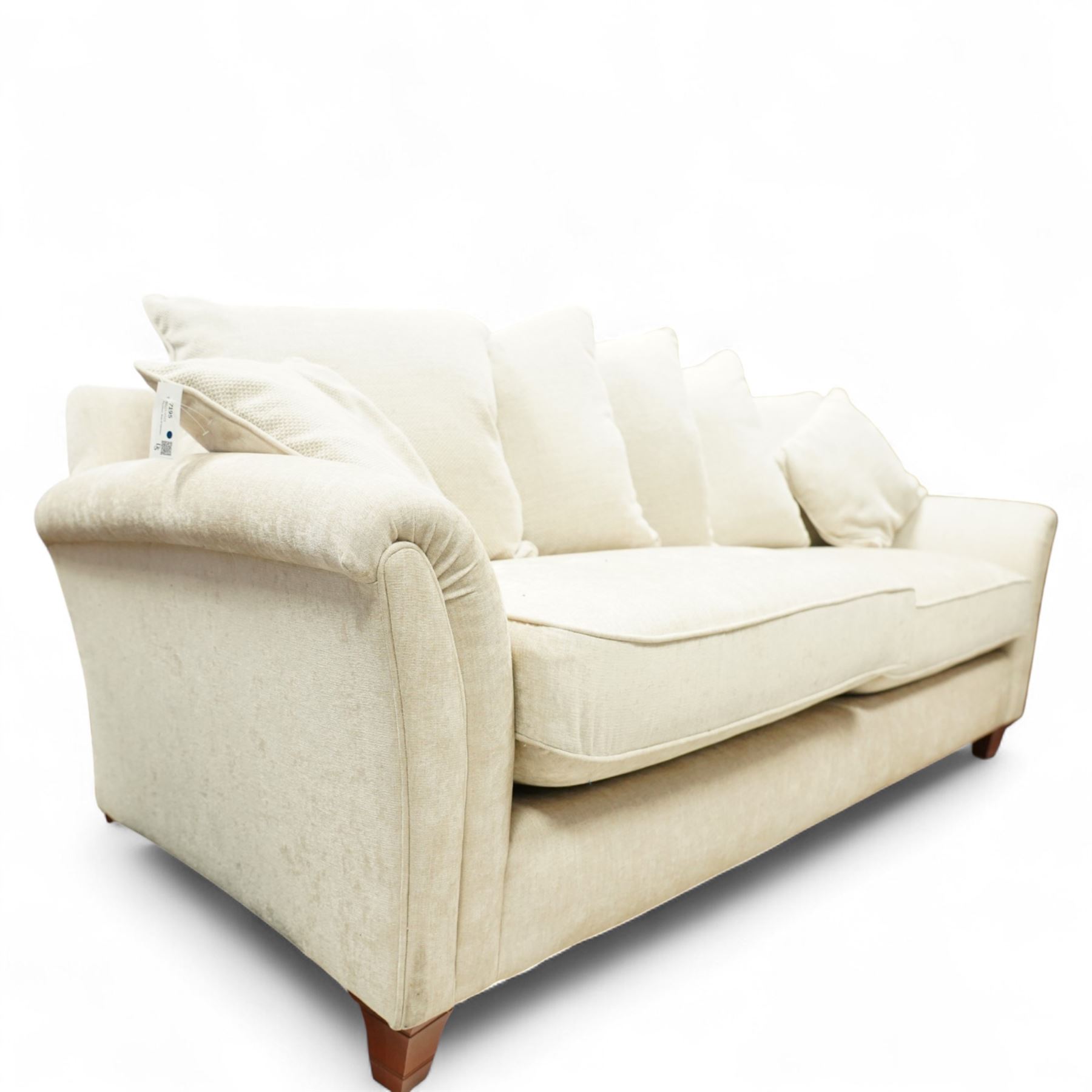 Parker Knoll - contemporary beige upholstered two seat sofa, with flared scroll arms and loose back and seat cushions, standing on stained tapered block feet
