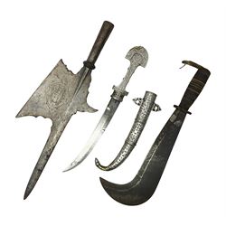 Moroccan jambiya dagger with 24.5cm plain curved blade stamped LONDON to the ricasso area, the hilt and scabbard overlaid with plain sheet brass to the back and ornate silver coloured metal to the front; waisted grip and arched pommel; two pyramid mounts to the scabbard L41cm overall; large billhook with curving blade and stacked leather washer grip; and a reproduction halberd blade (3)
