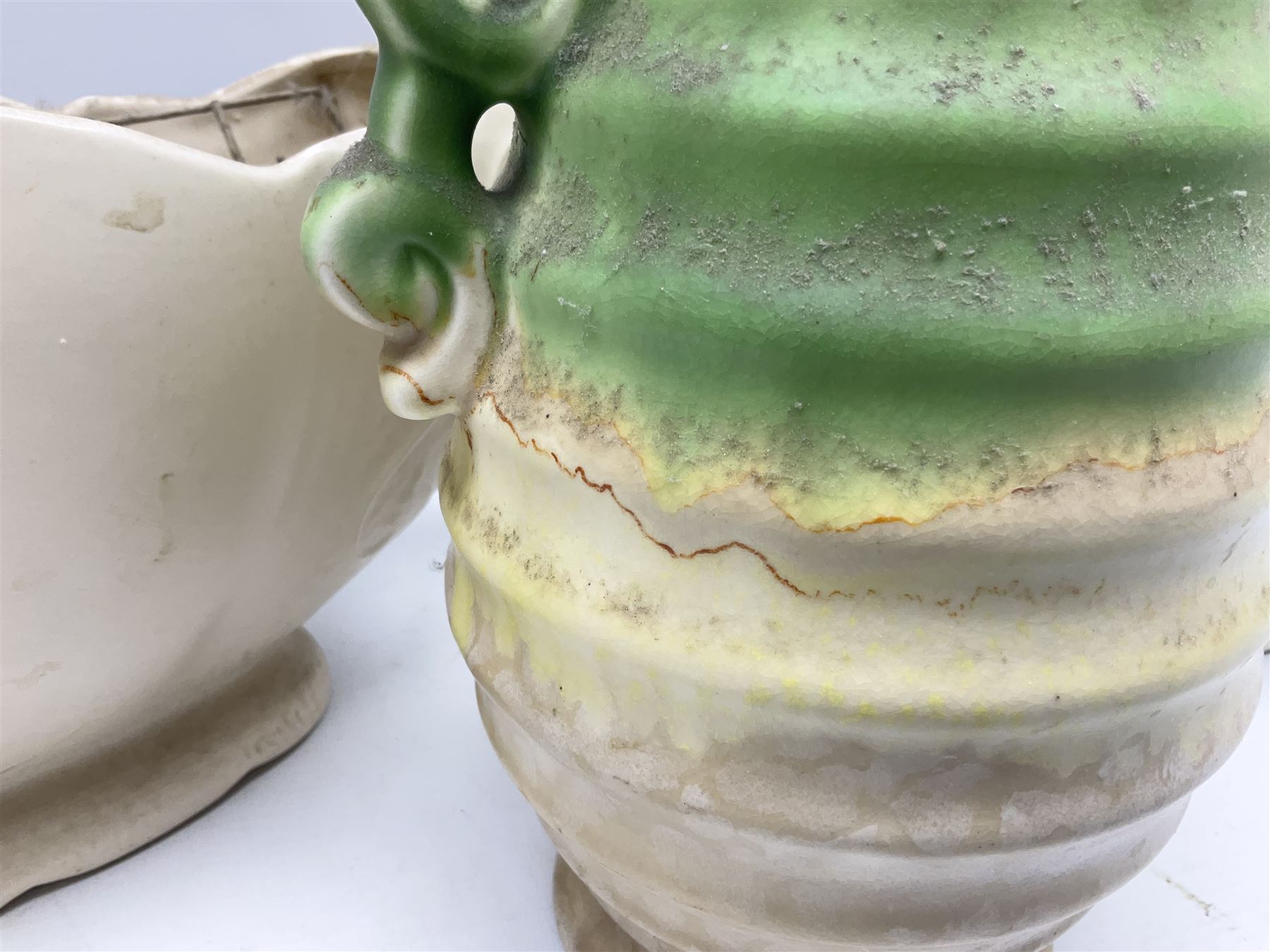 Two Arthur Wood twin handled vases to include one example in the Garden Wall pattern, together with a Beswick Ware merging green, yellow and cream vase, all with marks beneath, tallest H23cm