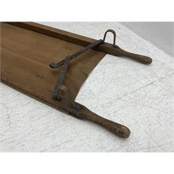 WW1 British casualty stretcher with iron mounted pitch pine sides and canvas base; stamped 'HL1917' and L7 with broad arrow in a triangle L236cm ( reputedly recovered from a barn at Bapaume on The Somme)