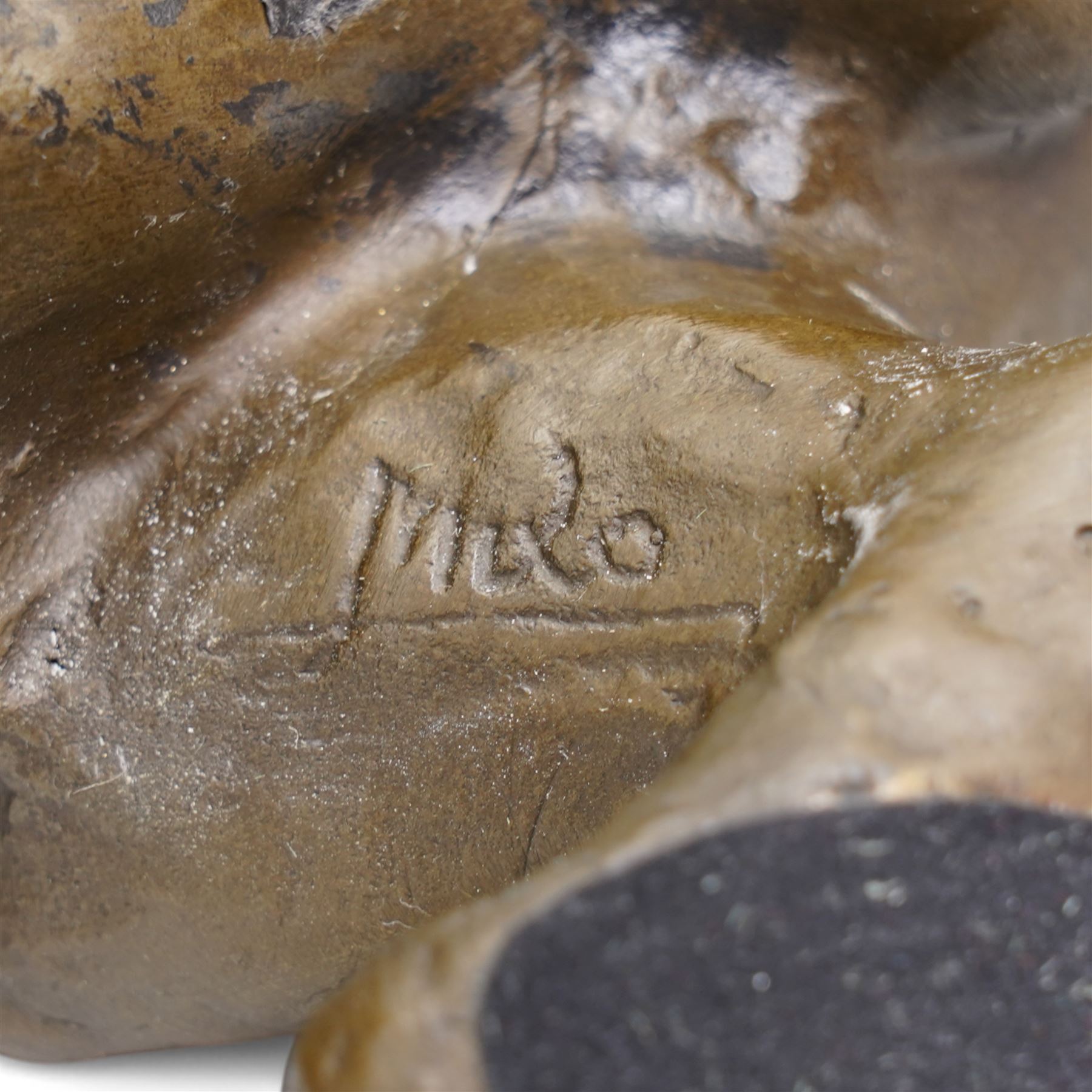 Bronze figure, modelled as a cougar or panther in crouching pose, signed Milo and also bearing foundry mark, L40cm