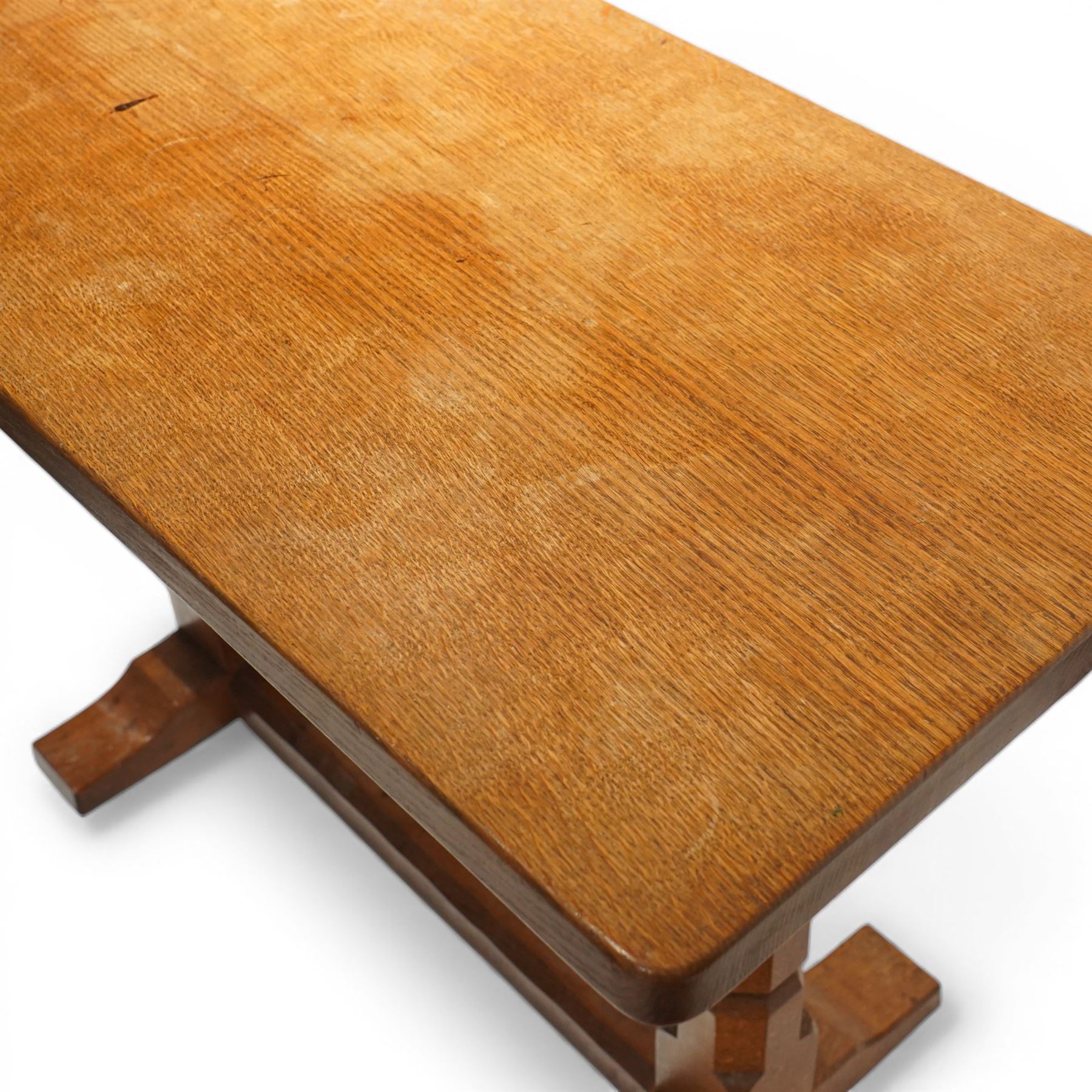 Mouseman - oak side table, rectangular adzed top, raised on octagonal supports united by stretcher on sled feet, with carved mouse signature, by the workshop of Robert Thompson of Kilburn