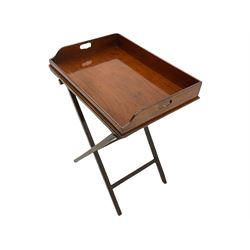 Early 19th century mahogany butler's tray on folding stand, the tray with raised gallery pierced for handles, the folding base with square moulded supports and hinged top