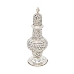Edwardian silver sugar caster, of typical waisted form profusely embossed with floral and foliate decoration, the removable pierced cover with fluted finial, upon a circular stepped foot, hallmarked William Aitken, Birmingham 1901, H23cm