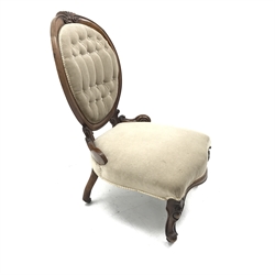 Victorian walnut framed nursing chair, shell carved cresting rail, upholstered in a buttoned fabric, cabriole feet, W60cm