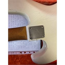 1963 Fender Jazz three-knob bass guitar; impressed with date code 7AUG63A on end of neck and serial no.L08587 on back plate; all original but re-finished in white in the 1970s; sold with photographs of the instrument in the 1960s with original finish and in the 1970s re-finished; L117.5cm; in original hard carrying case; Provenance: the professional guitar of Howard Livett from new to his death in 2005. Howard played in The Humperdincks, the backing group for Englebert Humperdinck, also played in the backing group for Max Bygraves and in the band Hedgehoppers Anonymous. The guitar is also sold with a manuscript letter of provenance from Howard's wife.