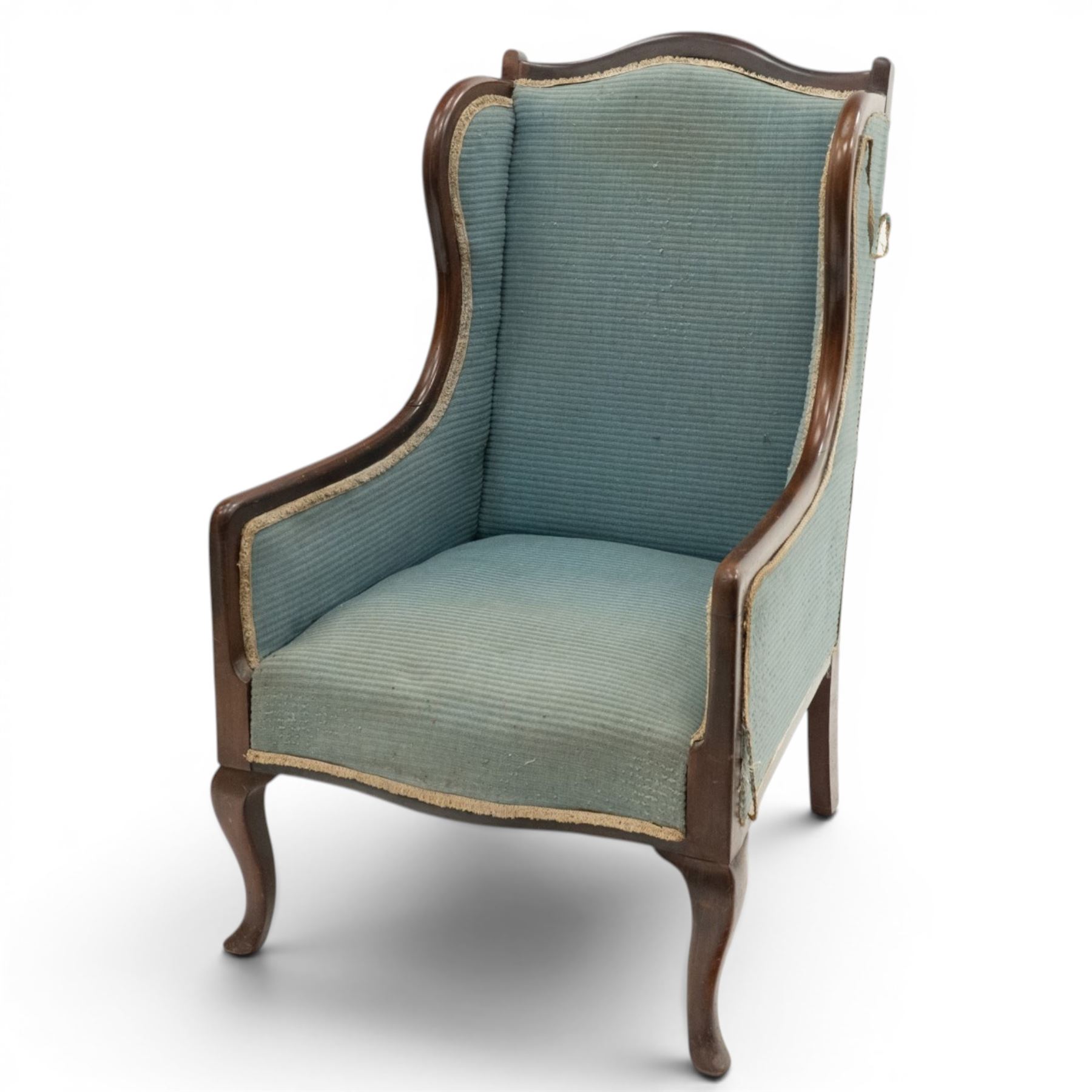Edwardian armchair of squared form upholstered in blue fabric, serpentine seat front, shaped frame raised on cabriole supports