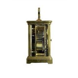 W.R. Cullen, London Street. Norwich. - 8-day French carriage clock c1900, in a corniche case with carrying handle and four bevelled glass panels, white enamel dial with Roman numerals, minute markers and spade hands, with a lever platform escapement and rack striking movement striking the hours and half hours on a coiled gong. 