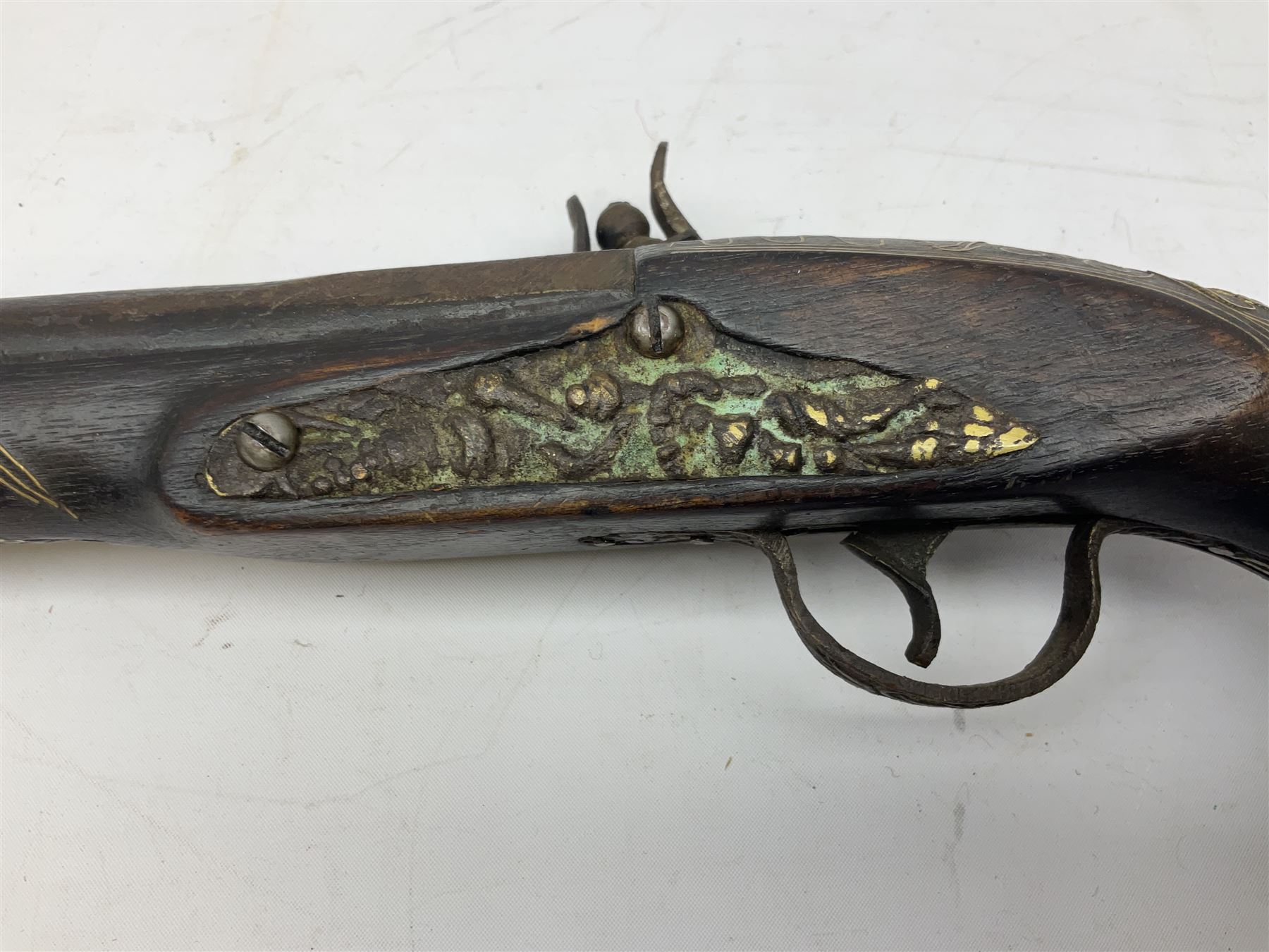 REGISTERED FIREARMS DEALERS ONLY - Reproduction flintlock pistol, the full walnut stock with brass filigree inlay and mounts and skull crusher butt L46cm; no visible proof marks - Disposed 25.06.25 - Notified 24.07.25