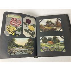 Postcard album with Victorian and later postcards, including silk cards, landscapes of the UK, portraits, Christmas cards etc  