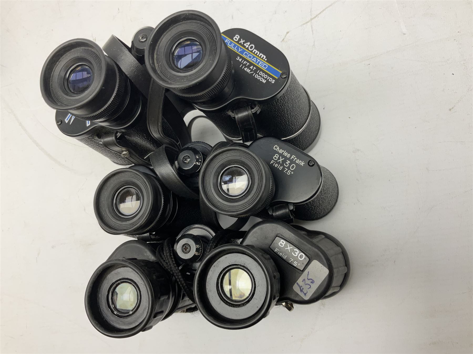 Eleven pairs of binoculars to include Lieberman & Gortz 20x65, Stem (USSR) 7x50, Helios 10x50 Field, Prinz 12x50, Tasco 8x40, Tasco 10x50, etc