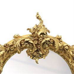 Pair of Louis XV style giltwood overmantel mirrors, the arched rectangular frame surmounted by an elaborate pierced cresting of acanthus scrolls, rocailles and floral swags, the moulded frame with continuous foliate carving and beaded inner slip