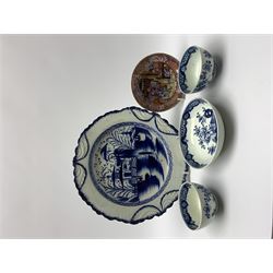 Late 18th century blue and white pearlware plate, with feathered edge decorated in the Long Eliza pattern, D24.5cm, together with two late 18th century blue and white tea bowls and a saucer, probably Lowestoft, each decorated with peony, rock and fence design, and an 18th century saucer decorated in Boy at the Window type pattern 