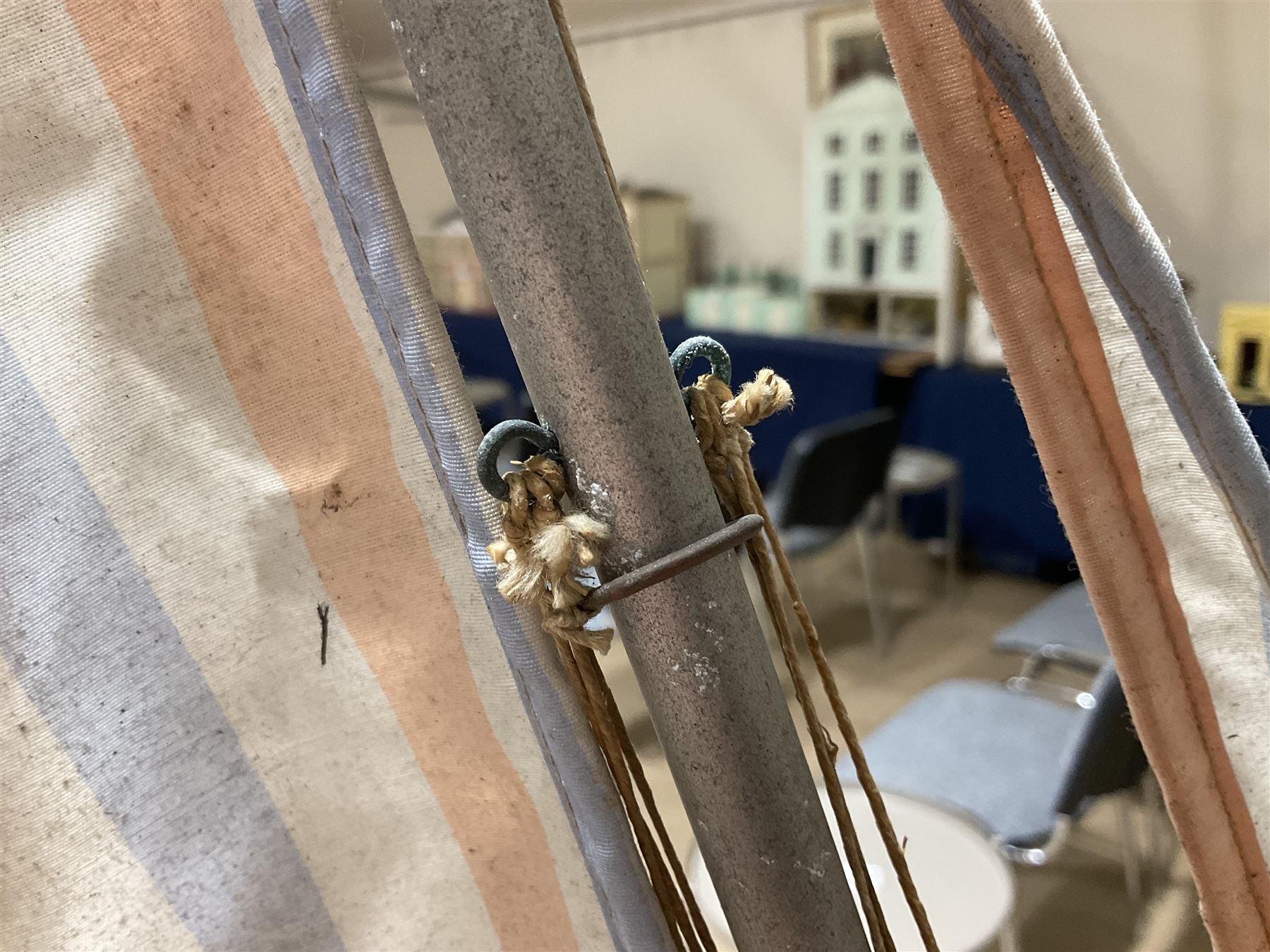 Large pond yacht with simulated planked mahogany deck, mahogany hull, wooden keel and stern fin and tubular aluminium mast with two sails; on wooden stand L131cm H on stand 177cm