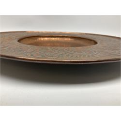 Arts and Crafts Keswick School of Industrial Arts copper charger, decorated with planished centre and repousse scrolling foliate tendrils to rim, D44cm