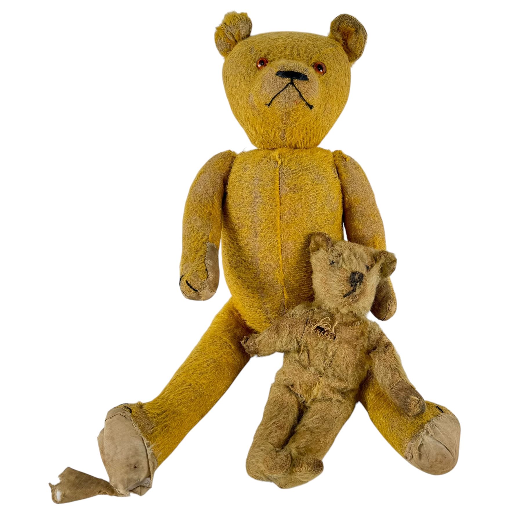 Two early 20th century straw-filled teddy bears