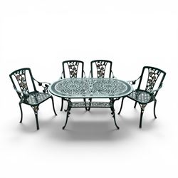 Cast aluminium oval garden table and set of four armchairs with pierced rose design back splats