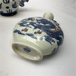  A small Chinese blue and white moon flask, with twin handles, the body decorated with a dragon chasing a flaming pearl amidst auspicious clouds, with Artemisia style leaf mark beneath, H17cm, together with a group of other assorted blue and white Oriental pottery.    