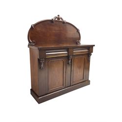 Victorian mahogany chiffonier sideboard, raised back with central cartouche pediment, fitted with two two drawers over two panelled cupboards, flanked by foliate corbels