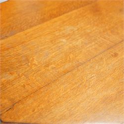 Late Victorian oak centre table, octagonal moulded top over a carved Gothic arched frieze, raised on quadruple baluster turned supports united by X-stretcher with ebonised detailing