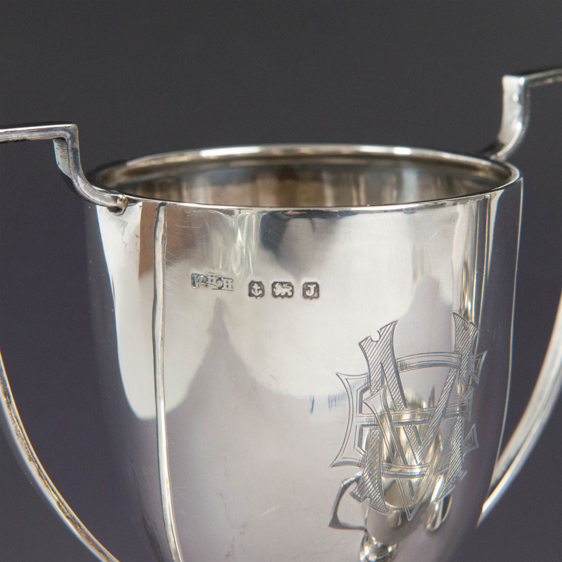 Pair of 1930s silver trophies, with angular handles and presentation engravings to body, hallmarked William Hair Haseler, Birmingham 1938, together with a similar smaller example, hallmarked Charles Boyton & Son Ltd,  London 1927, tallest H13cm