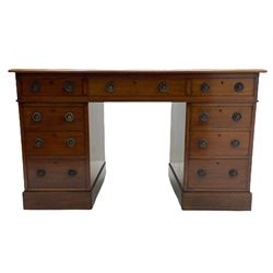 Howard & Sons. - 19th century walnut twin pedestal desk, moulded rectangular top with tooled leather inset, fitted with nine drawers with circular pressed brass handle plates decorated with urns, each drawer fitted with a 'Hobbs, London' lock, on plinth base, the upper right-hand drawer stamped 'Howard & Sons, Berners St.' and with paper label