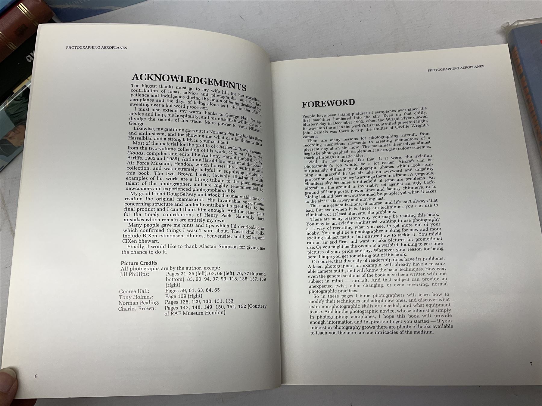 Ten books of predominantly military aircraft interest including Aircraft Anatomy World War Two, Hurricane Messerschmitt, The Avro Lancaster, The Luftwaffe Album, Encyclopaedia of Aircraft of WWII etc; together with a scrap album of WW2 newspaper cuttings