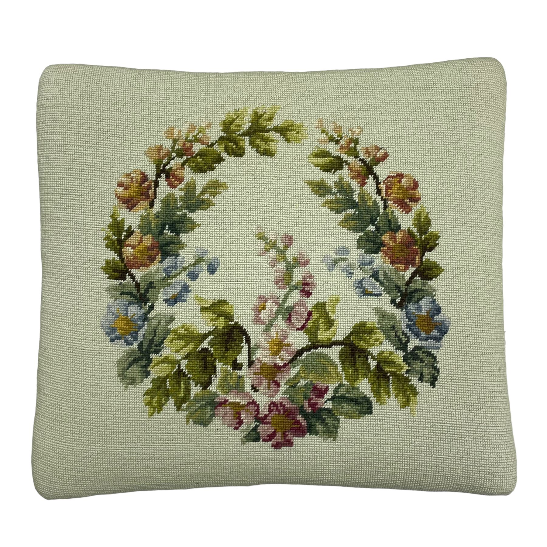 19th century French walnut dressing stool, rectangular seat upholstered in a floral needlework tapestry top, shaped apron with applied carved flower heads, on cabriole supports with acanthus carved feet