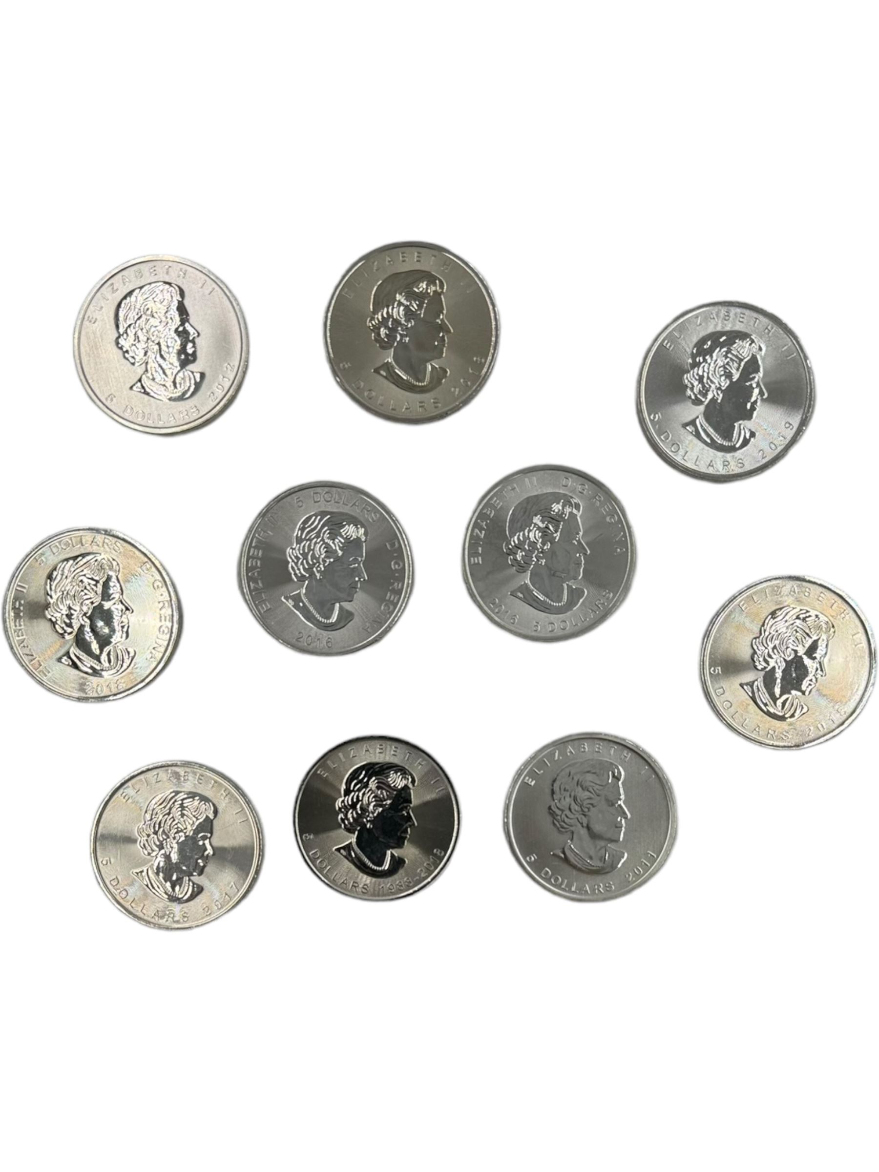 Ten Queen Elizabeth II Canada one ounce fine silver five dollar coins, including 2012 'Majestic Moose' 2016 'Superman', 2018 'Maple Leaf', 2019 'Maple Leaf', etc