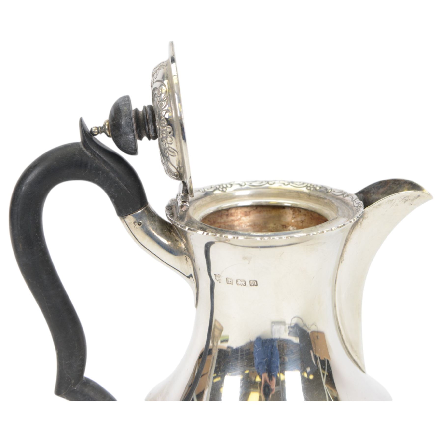 1920s silver hot water pot, with chased and repousse decoration to body depicting pheasants and rabbits in a countryside setting, with Bakelite type handle and finial, upon three palmette mounted feet, hallmarked S Blanckensee & Son Ltd, Birmingham 1928, H22cm