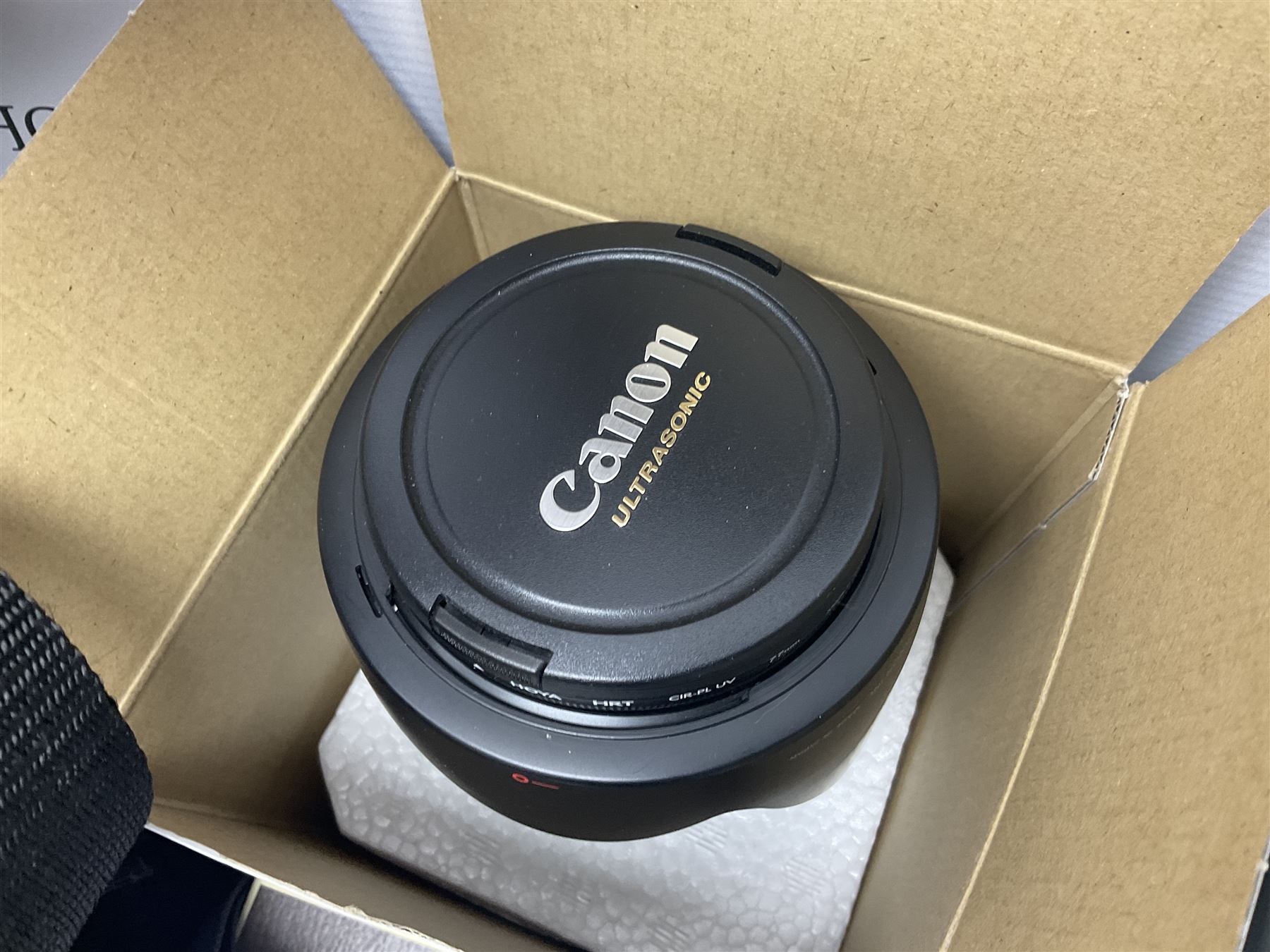 Quantity of camera accessories and equipment, to include boxed Canon EFS 17-55mm IS lens, Canon 59s camera, Olympus camera, etc