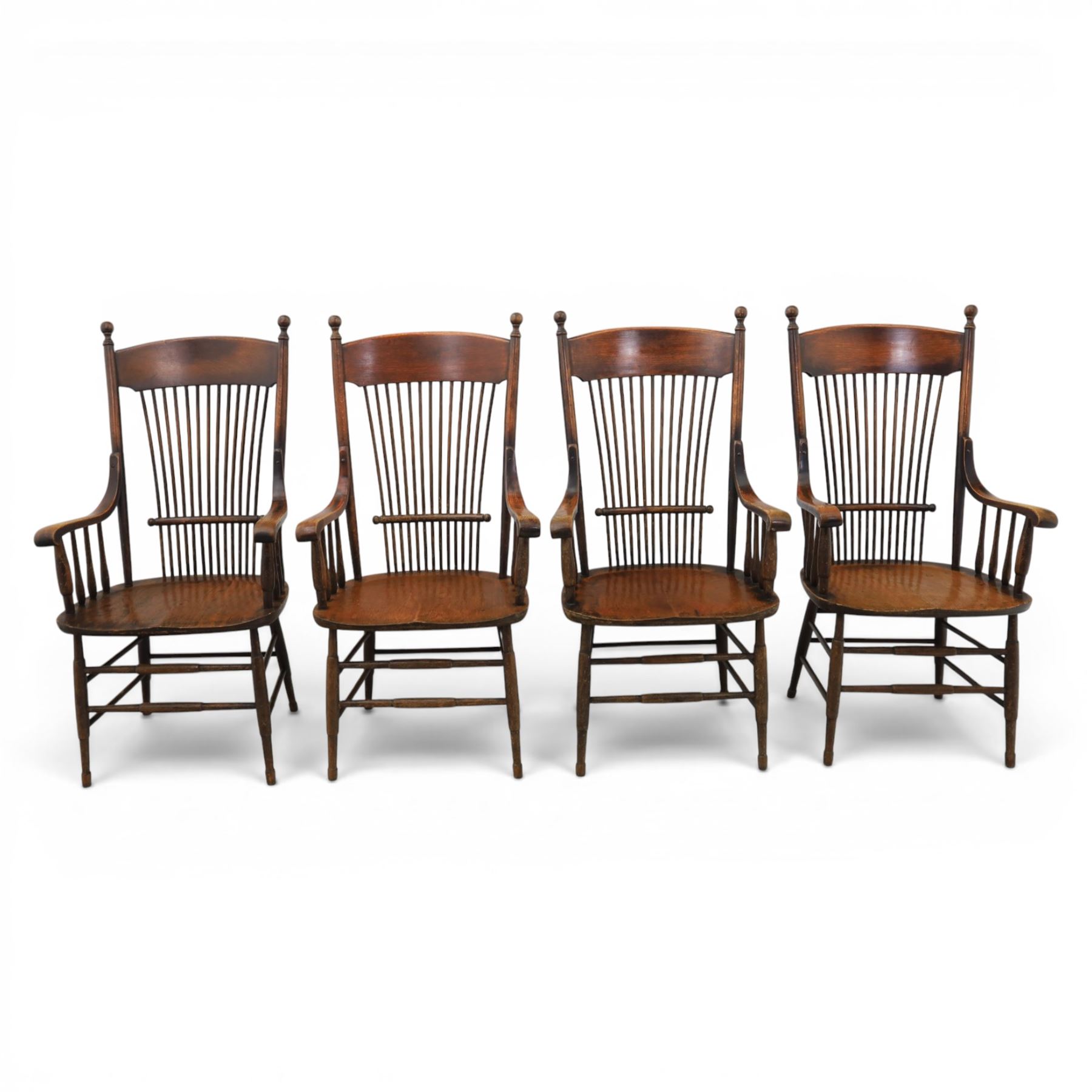 Set of eight 19th century ash and elm spindle back Windsor armchairs, arched top rails above fan-shaped spindle backs, curved arms with turned supports, shaped saddle seats, on turned legs joined by H-stretchers