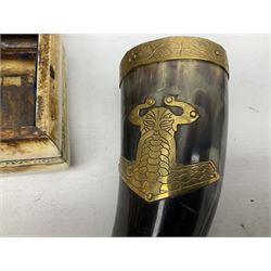 Swiss mountain hunters tobacco pipe with a horn mouthpiece, metal hinged pierced lid and brass chain, the black coated body adorned with small metal cow flowers, together with two other pipes and case, brass mounted horn, brass mounted bone box, carved mother of pearl handled knife and fork and brass jug