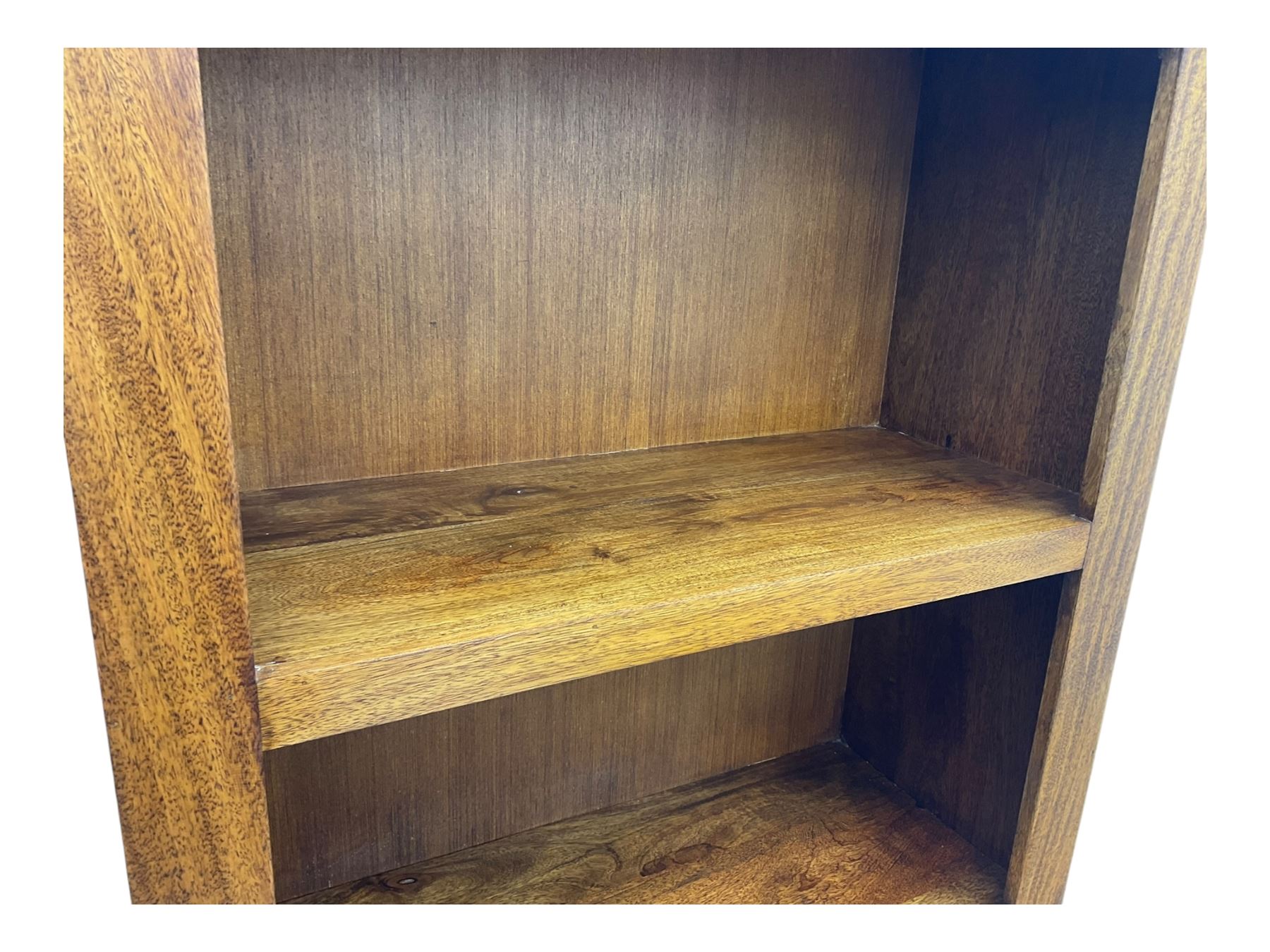 Contemporary Dakota mango wood open bookcase, rectangular form with four fixed open shelves, raised on stile supports