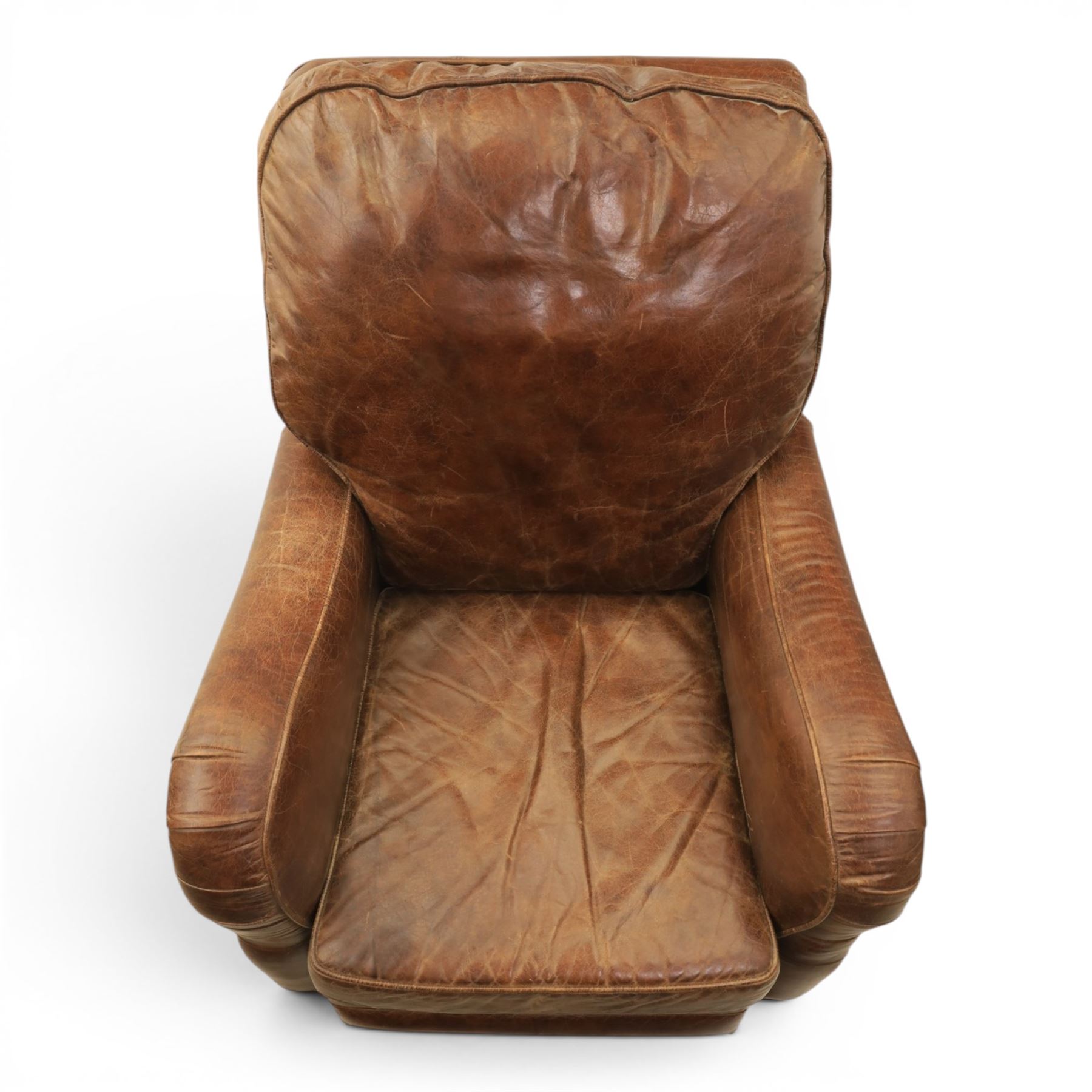 Art Deco style brown leather reclining armchair, scrolled arms with brass studded trim, reclining foot rest and back, fixed back and loose seat cushion,