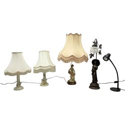 A Belcari figural table lamp, modelled as a young gent leaning upon brick wall, on turned wood base, signed, H70cm incl shade, together with bronzed figural table lamp of a lady with parasol upon ornate circular plinth base, two ceramic table lamps and another lamp (5)