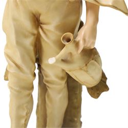 Pair of Ernst Wahliss for Turn Wien porcelain figures of Middle Eastern water carriers, taller figure H35cm