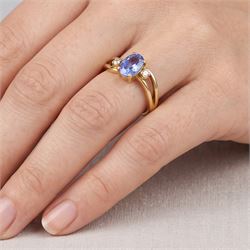 18ct gold sapphire and diamond three stone crossover ring, single oval cut sapphire of approx 1.15 carat, with a single cut diamond set either side, Birmingham 1991
