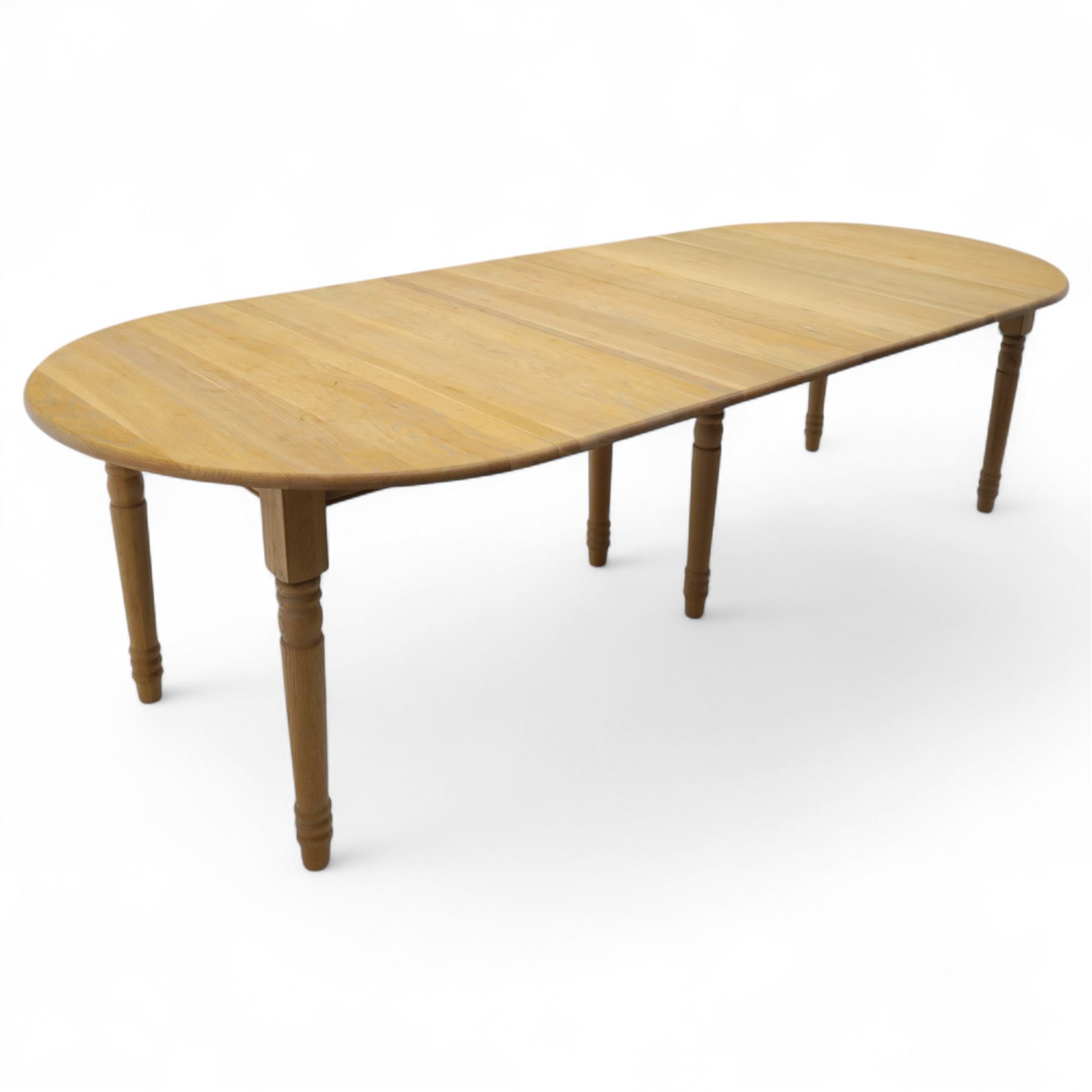 Neptune – Sheldrake limed oak extendable dining table and eight Havan loom chairs, the oval top in limed oak finish with four additional leaves extending the table to seat up to ten (Extends to cm), raised on turned legs with two additional centre supports, the matching Havan loom chairs finished in grey with cream upholstered seat covers (H 95cm, W 47cm, D 55cm)